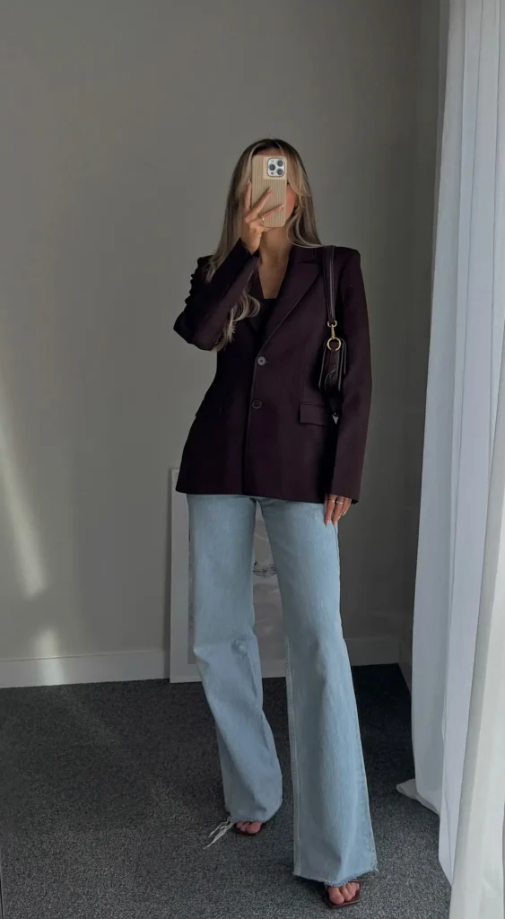Petite blazer outfit with a dark plum structured blazer over a deep V camisole and light wash wide-leg jeans with barely-there strappy heels, mirror selfie