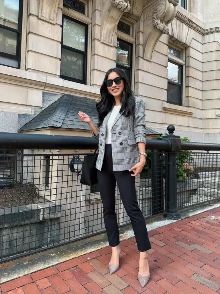Grey plaid double-breasted blazer outfit with black cropped trousers, nude pointed-toe pumps, and a structured black tote, street style
