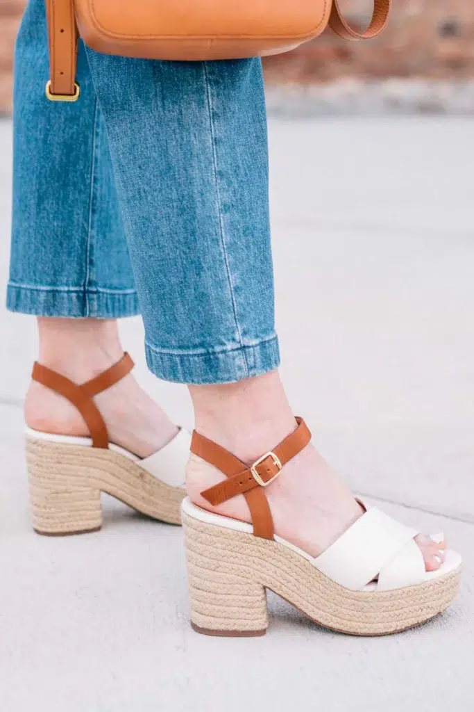 Wide-leg cropped jeans hitting above the ankle bone with white and tan espadrille platform sandals, showcasing a flattering petite outfit.